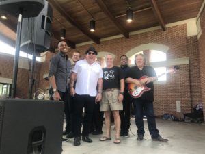 MonoSol CEO P. Scott Bening with the band MonoSoul at the company's annual picnic in downtown Valparaiso.